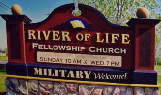 Stucco Monument Sign with raised gold leaf lettering and hand carved gold leaf bible